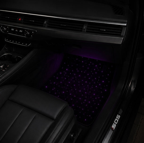 Velvorex Starlight floor mat glowing in the footwell of an Audi SQ5